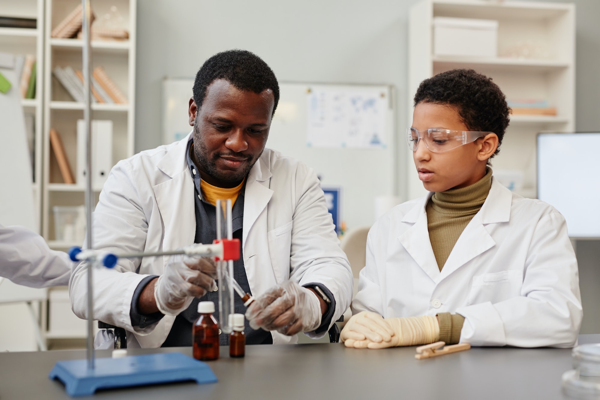 Teacher Showing Experiment in Lab